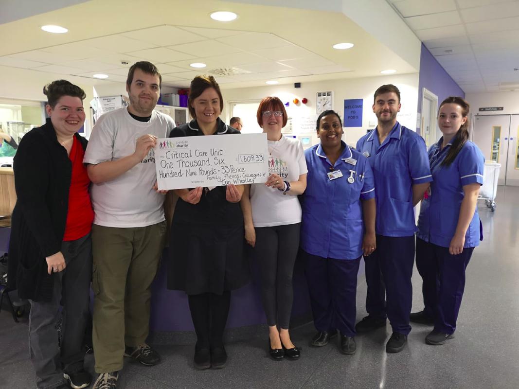 My wife (far left), me, and my mother in law (middle) with staff in the Critical Care ward at Royal Stoke Hospital handing a cheque over for over £1600.